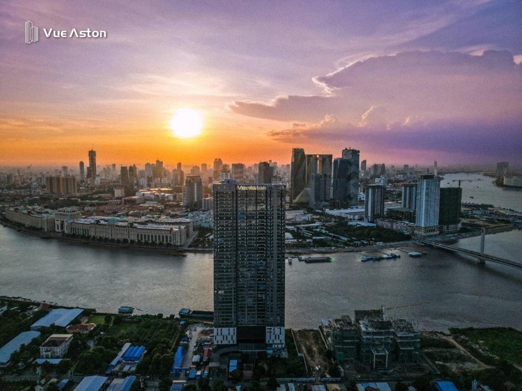 a view of a city with the sun setting at Vue Aston in Phnom Penh