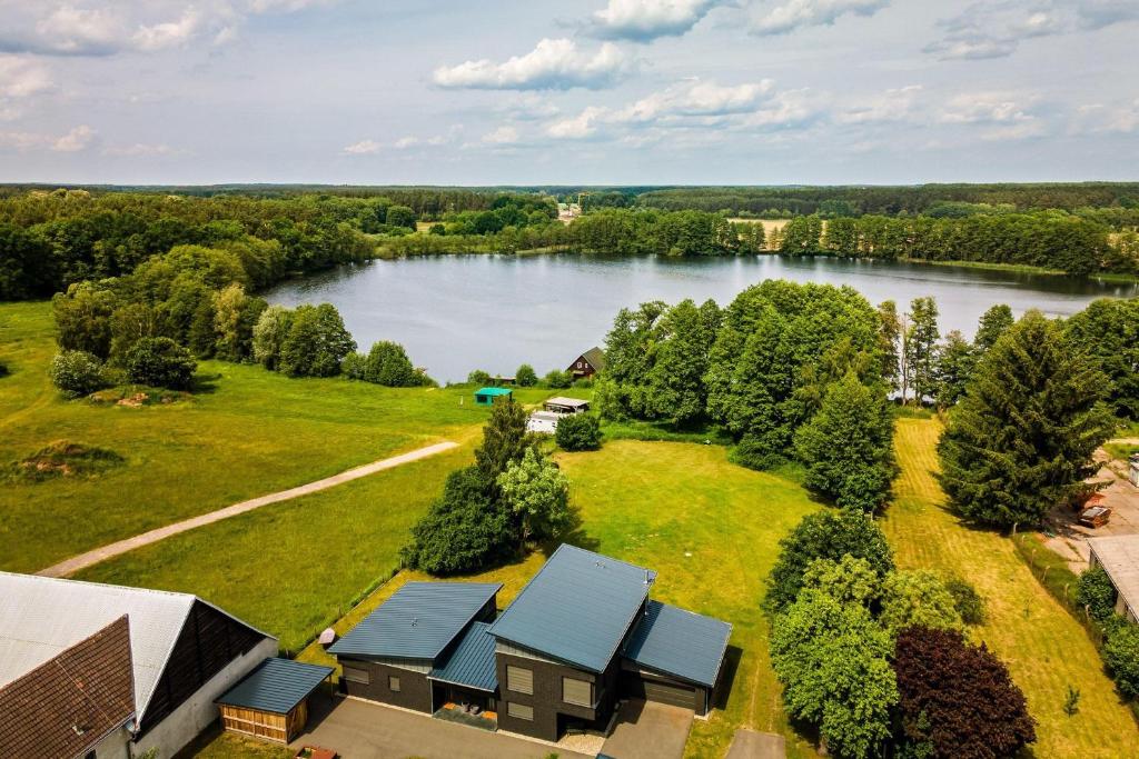 an aerial view of a house and a lake at Ferienwohnung-Cleo in Mirow