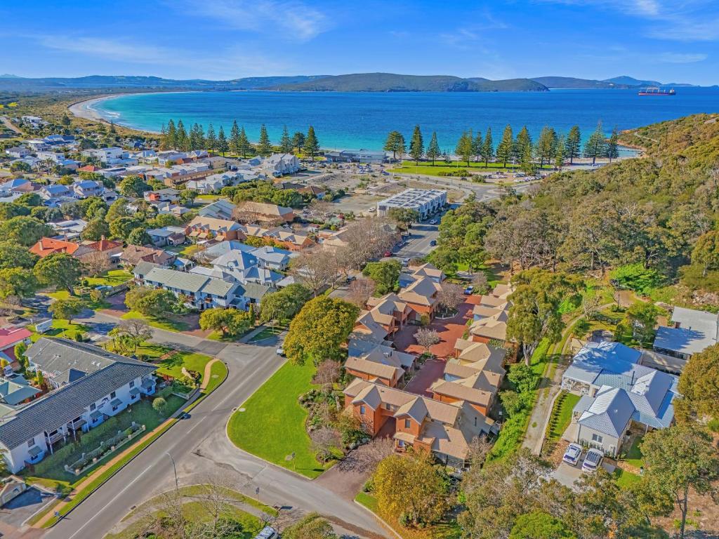 an aerial view of a suburb with houses and the ocean at Middleton Beach by the BnB Collection in Albany