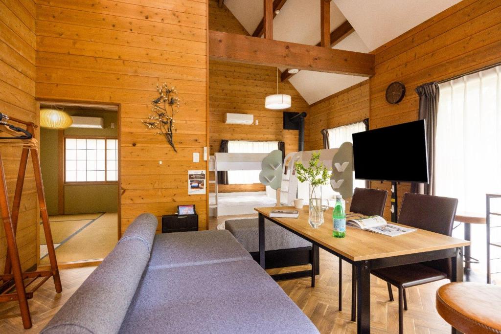 a living room with a couch and a table at S-villa Nasu 4th in Nasu