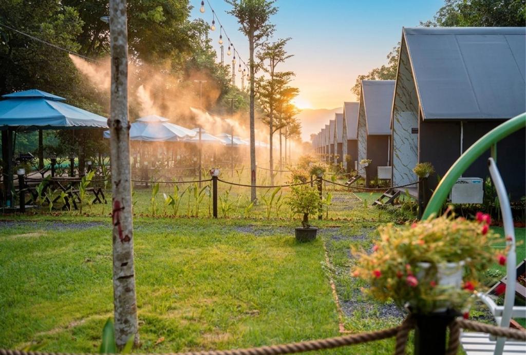a fire in a yard with a fence at Mekong Hotel in Tây Ninh