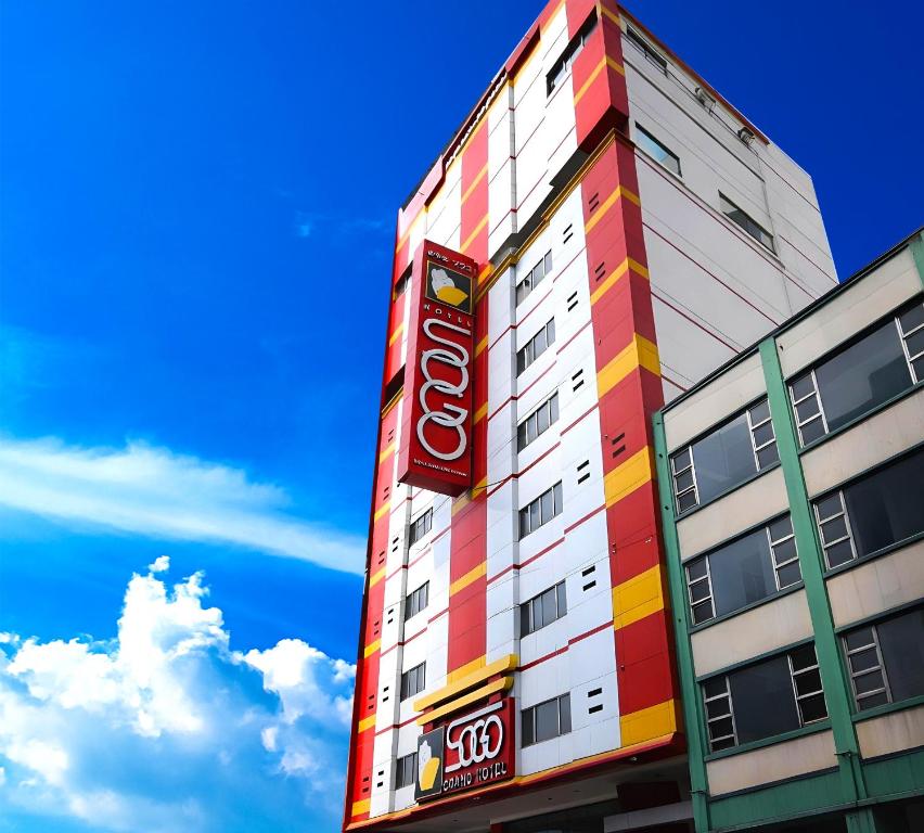 a building with a coke sign on the side of it at Hotel Sogo Edsa Cubao in Manila