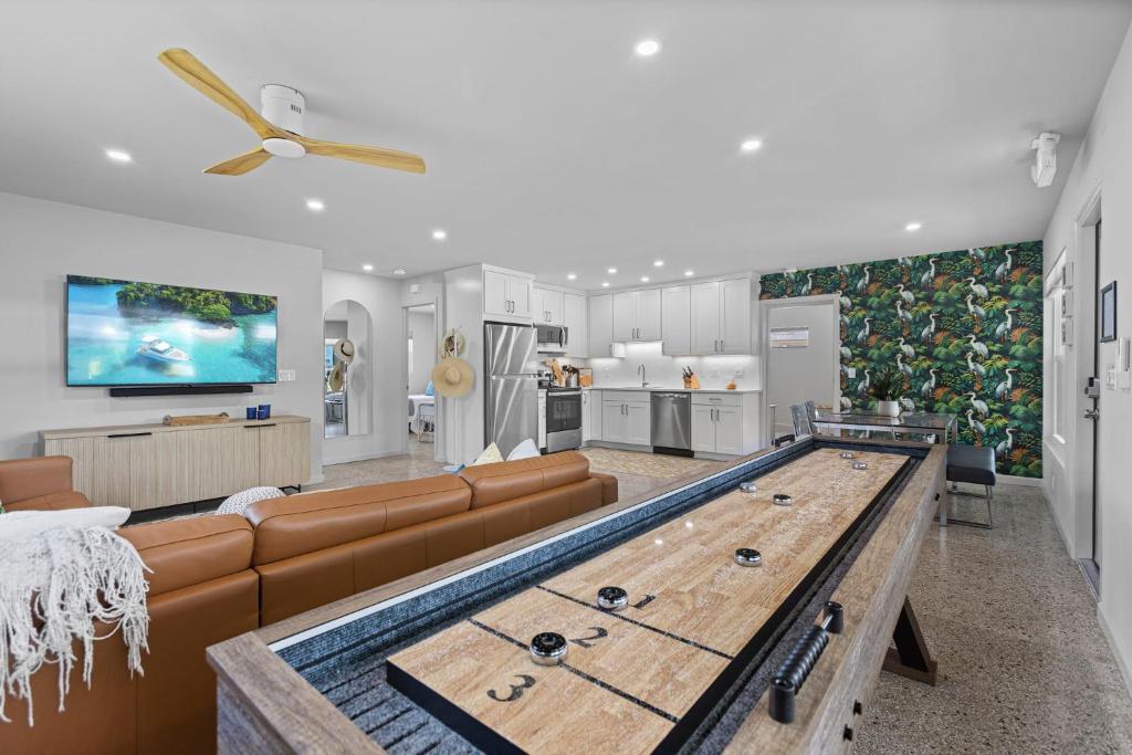 a large living room with a pool table in it at Neptunes Hideaway in Vero Beach