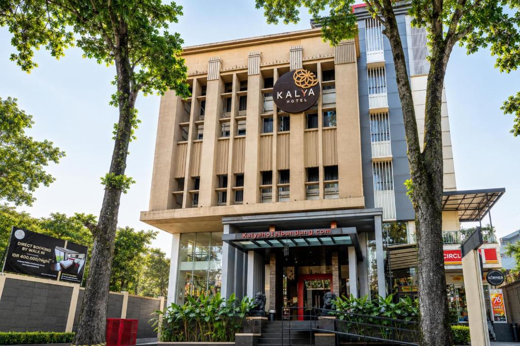a building with a sign on the front of it at Kalya Hotel Bandung Dago in Bandung