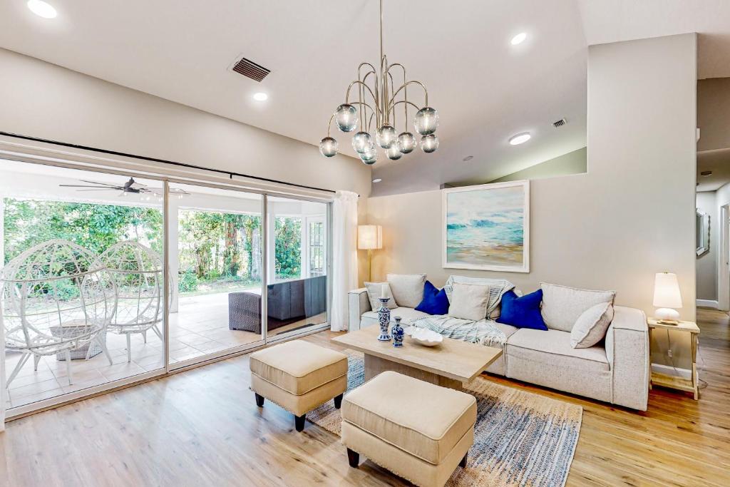 a living room with a couch and a table at Lush Leisure - 816 Twenty Third Ave in Vero Beach