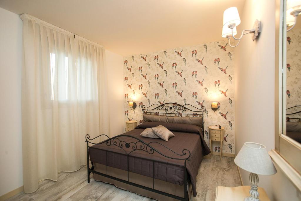 Postel nebo postele na pokoji v ubytování Guest House Dolce Laguna