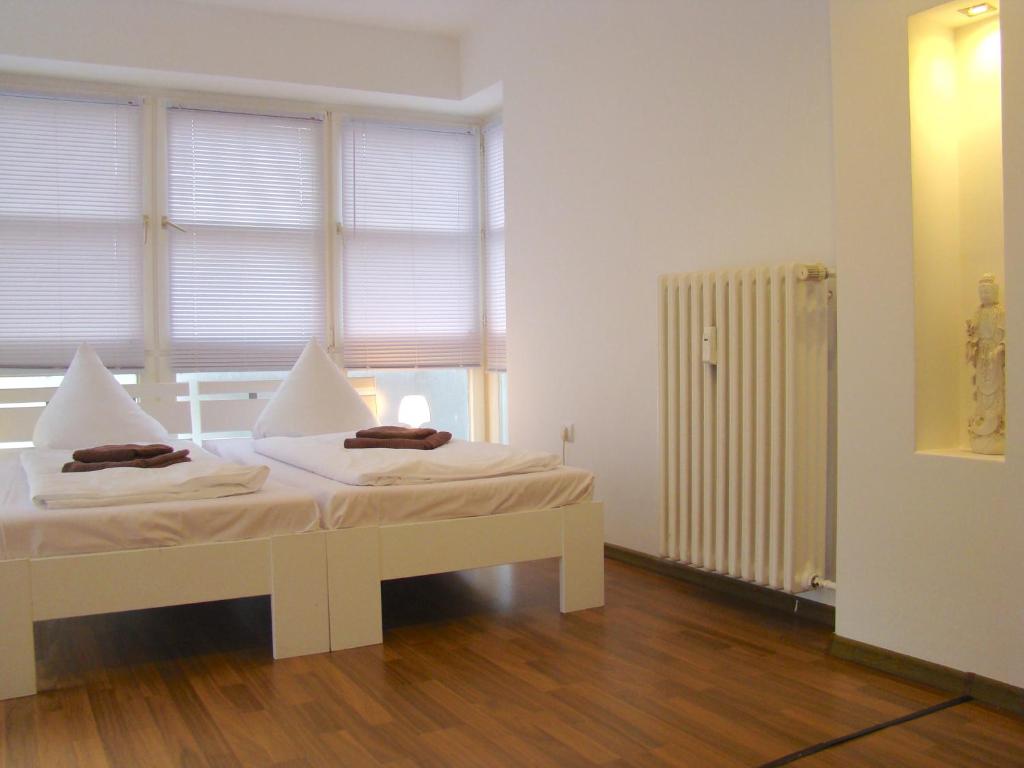 Postel nebo postele na pokoji v ubytování Rooms & Apartments near Zoologischer Garten