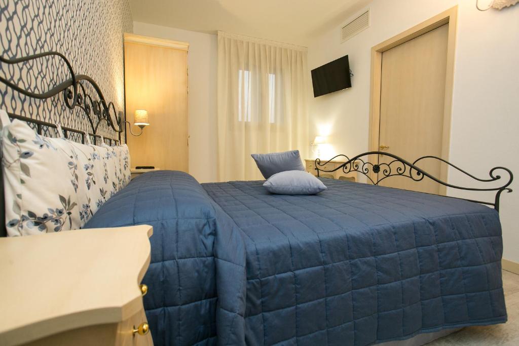 Postel nebo postele na pokoji v ubytování Guest House Dolce Laguna