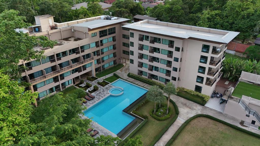 an overhead view of a building with a swimming pool at River Tree Resort in Chiang Khan