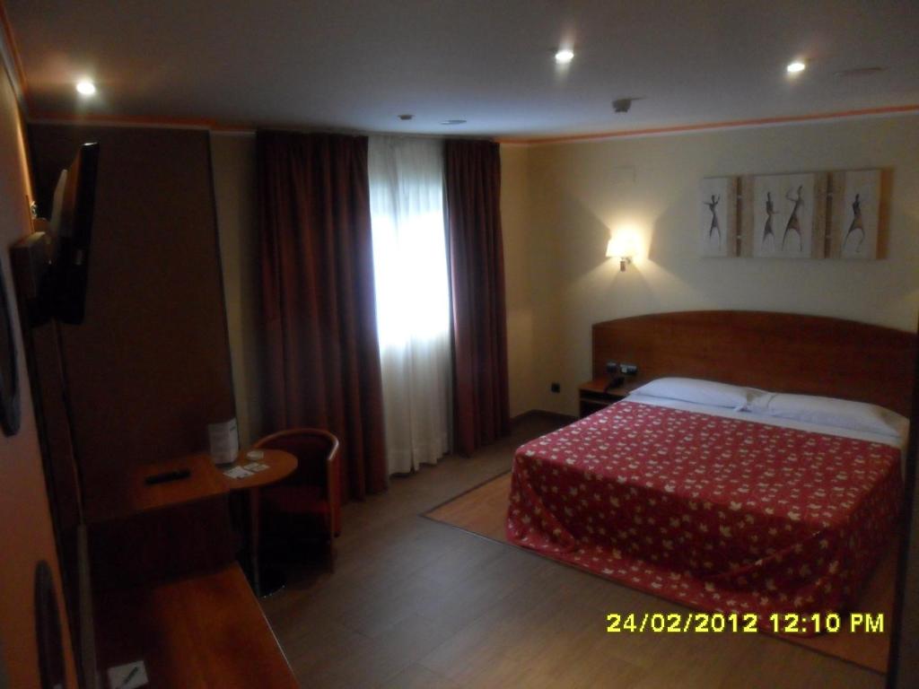 Posteľ alebo postele v izbe v ubytovaní Motel Emporio