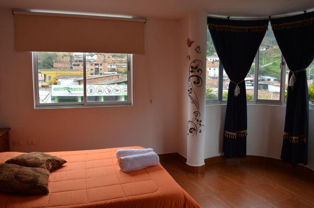 Postel nebo postele na pokoji v ubytování Hotel Dancar