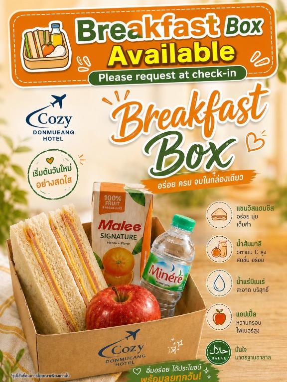 A promotional breakfast-box graphic showing sandwiches, fruit and bottled drinks.