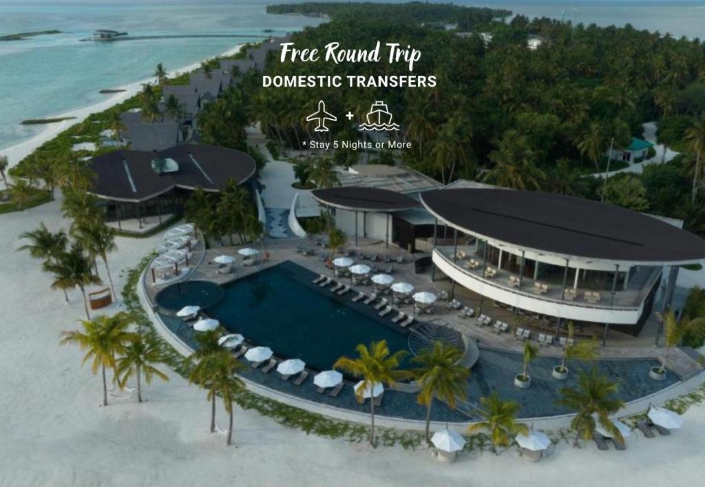 an aerial view of a resort with a swimming pool at Madifushi Private Island- Stay 5 Nights or More & Enjoy Free Roundtrip DOMESTIC FLIGHT & SPEEDBOAT in Meemu Atoll