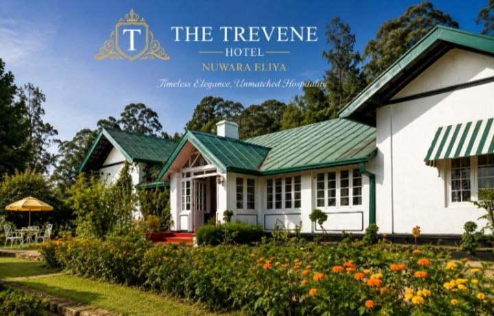 a white house with a green roof at The Trevene Hotel in Nuwara Eliya