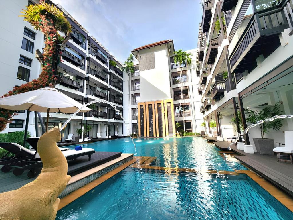 a swimming pool in the middle of a building at Rarin Jinda Wellness Spa Resort in Chiang Mai