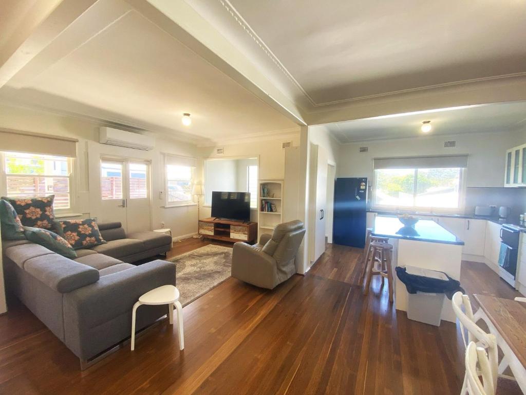 a living room with a couch and a table at 10 Clarke in Nambucca