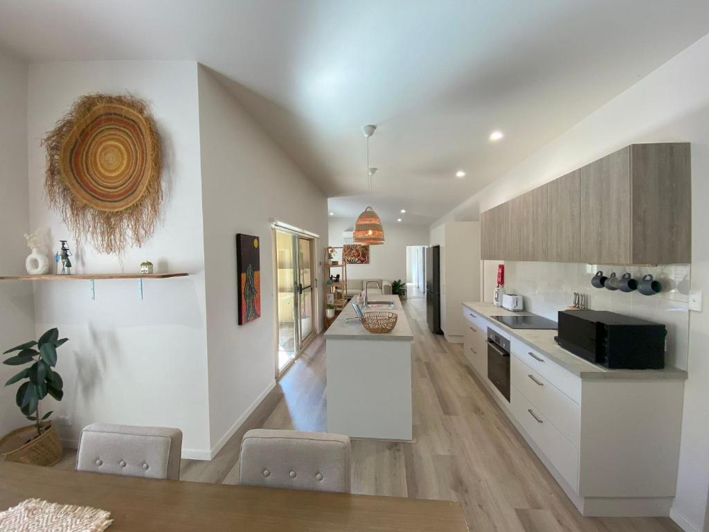a kitchen with white walls and a counter top at Charming Beach Getaway in Valla Beach