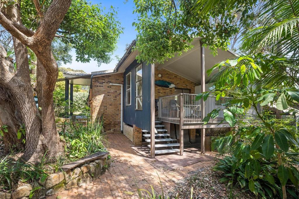 a house with a porch and a deck at Coastal Charm in Valla Beach
