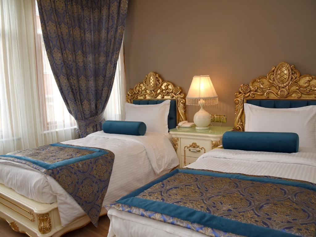 Postel nebo postele na pokoji v ubytování İstasyon Hotel