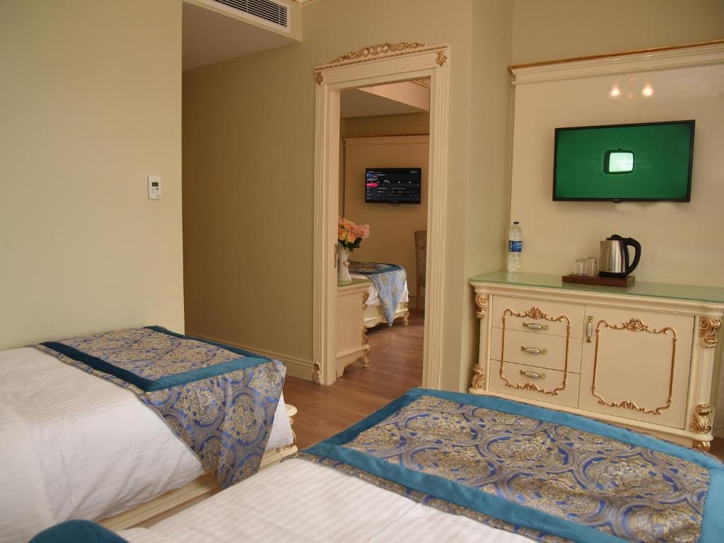 Postel nebo postele na pokoji v ubytování İstasyon Hotel
