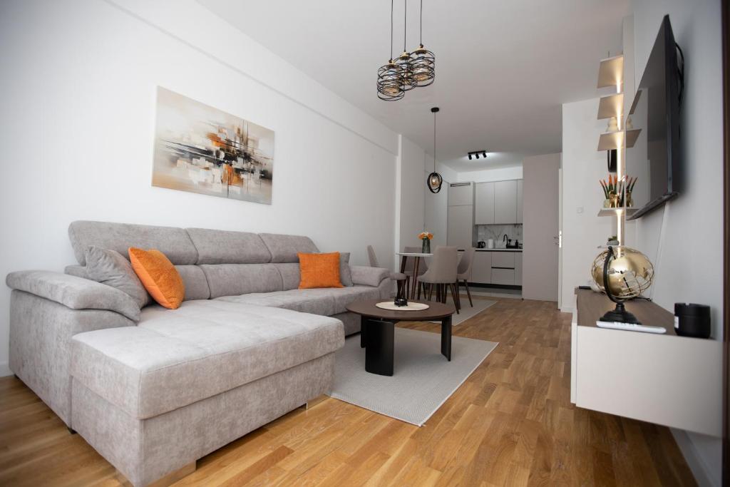 a living room with a couch and a table at Apartman Solis in Trebinje