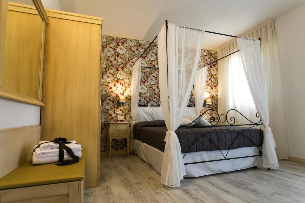 Postel nebo postele na pokoji v ubytování Guest House Dolce Laguna