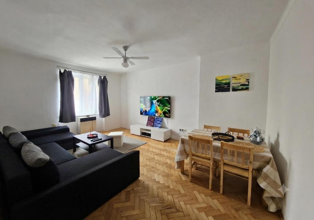 a living room with a couch and a table at 2 bedroom apartment, near Xbionic in Šamorín