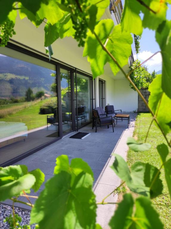 an internal view of a patio with sliding glass doors at Apart Loris in Hart im Zillertal