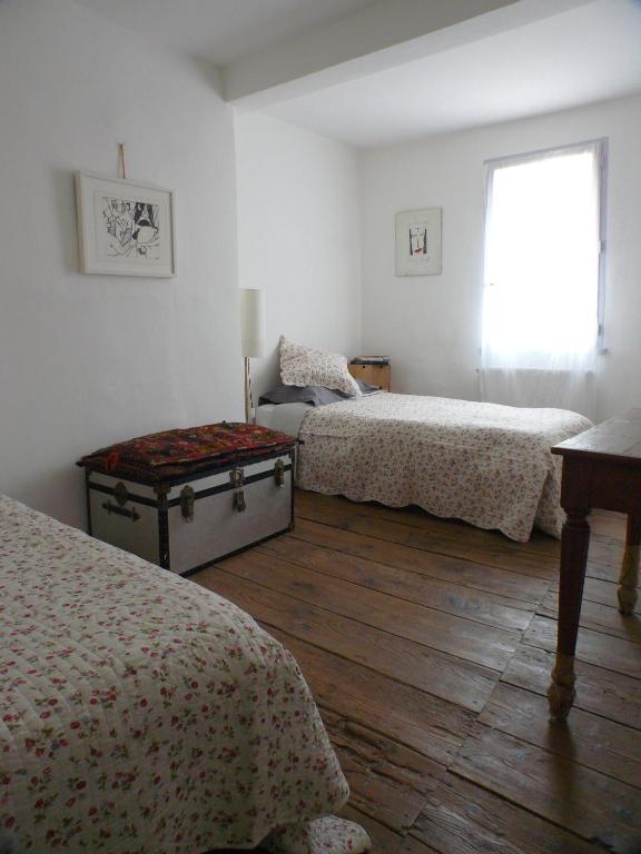 Postel nebo postele na pokoji v ubytování Nidélice Chambre d'hôtes