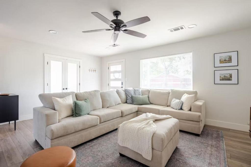 a living room with a couch and a ceiling fan at Remodeled 4BR 2BA Steps from Georgetown Square in Georgetown