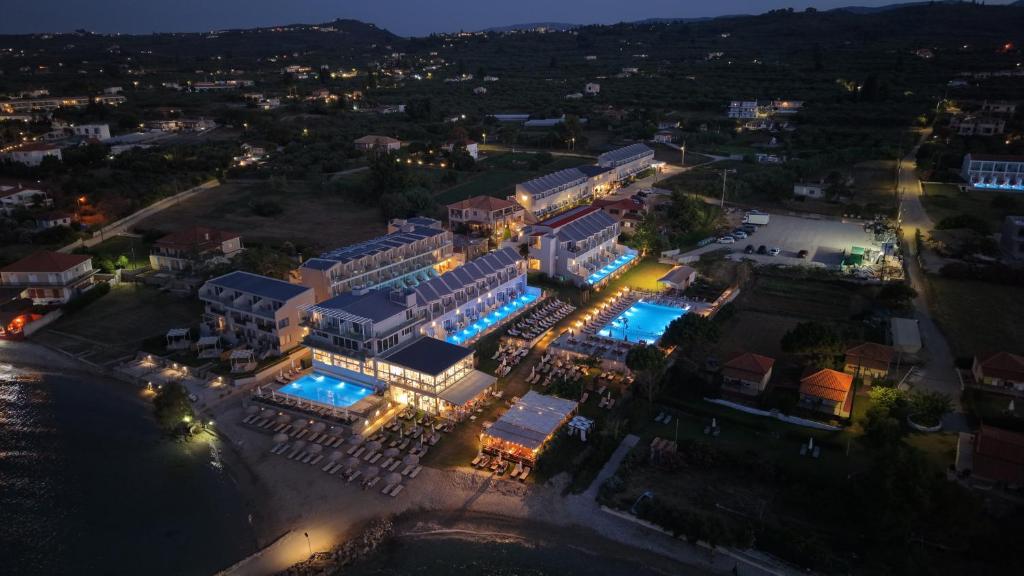 an aerial view of a resort at night at Golden Coast Suites in Kypseli