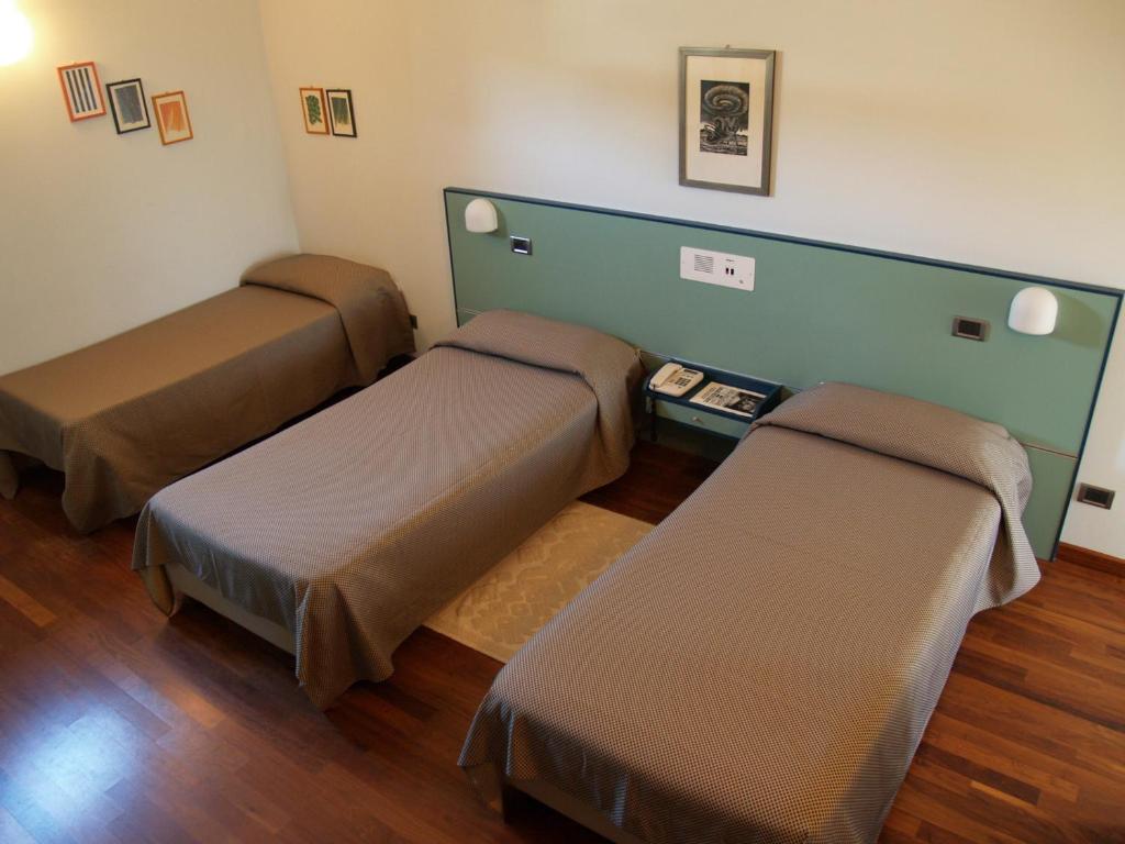 Postel nebo postele na pokoji v ubytování Deco Hotel