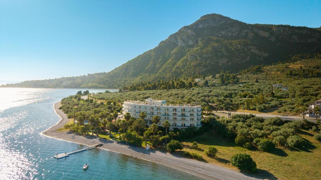 an aerial view of a resort on a beach next to the water at HOTEL SISSY in Kamena Vourla
