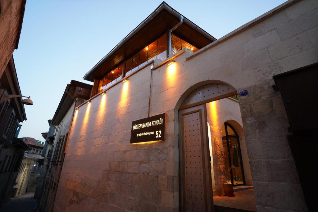 a building with a sign on the side of it at Gülten Hanım Konağı in Gaziantep