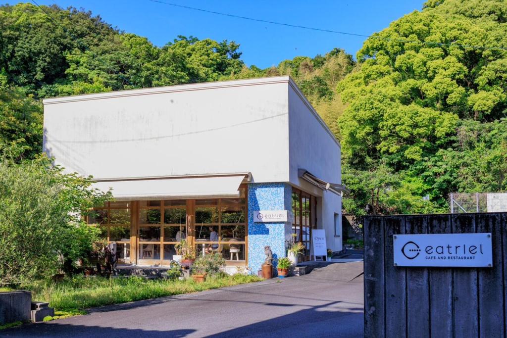 a building with a sign in front of it at tomariel in Ō-shima