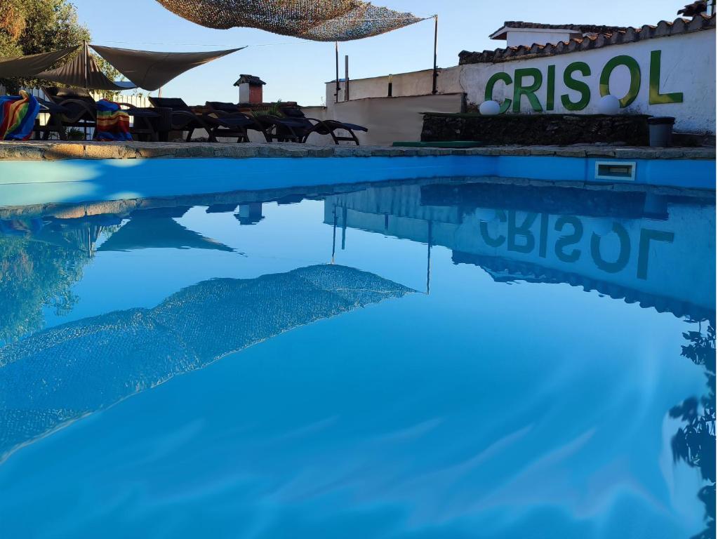 a pool of water in front of a building at Casa Rural Crisol Spa in Arenas de San Pedro