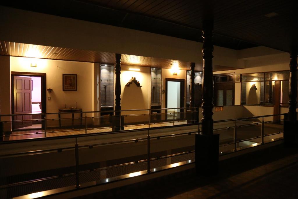 a view of the inside of a building at night at Hotel Mudra Midtown Suites & Rooms in Kalasa