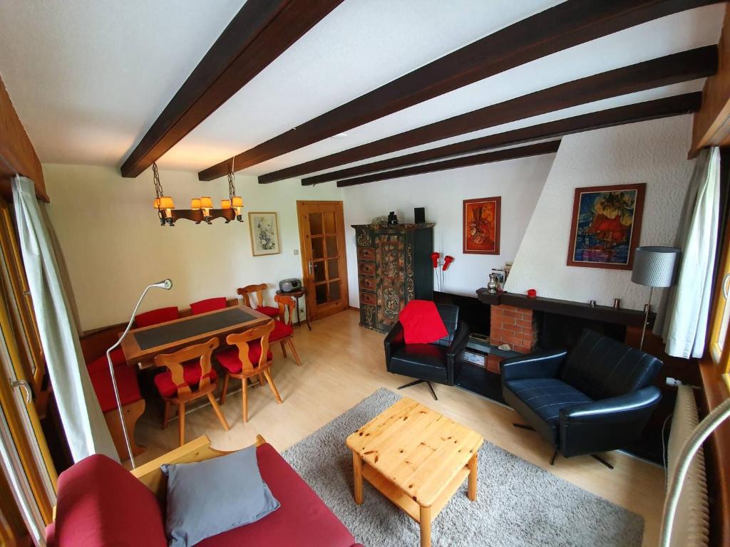 a living room with a couch and a table at Dent-Blanche in Les Collons