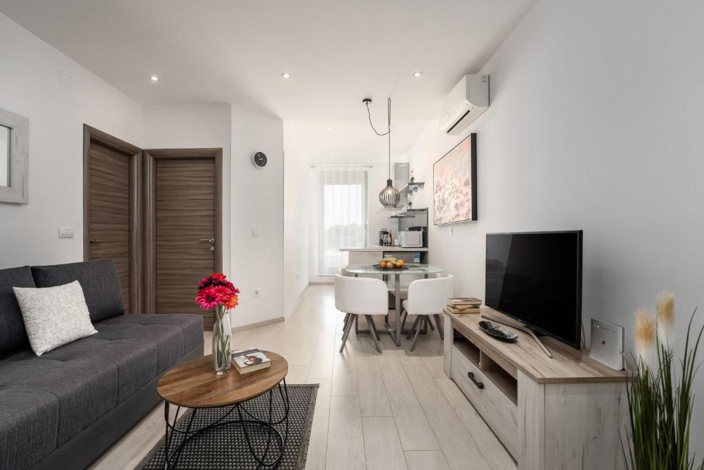 a living room with a couch and a table at SILVER luxury in Pula