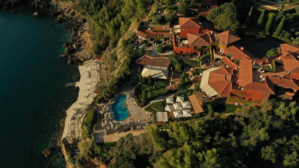 an aerial view of a house on the water at Il Pellicano in Porto Ercole