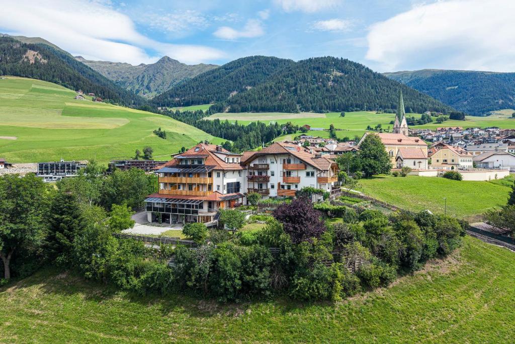 an aerial view of a village in the mountains at Residence Treyer in Terento