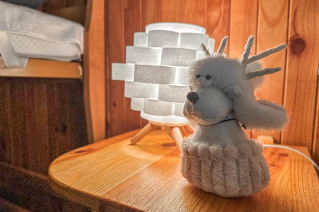 a stuffed animal sitting on top of a table at L'Argentière - Nature - Calme - Ski in Le Bourg d'oisans