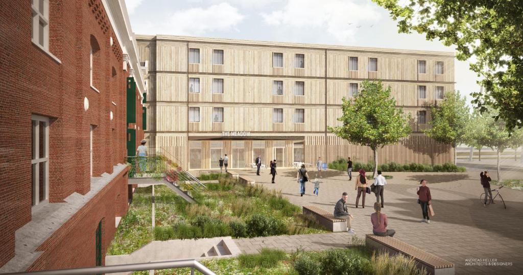 un rendering di un edificio con persone che camminano davanti di MEADOW Gronau by Hackmann a Gronau