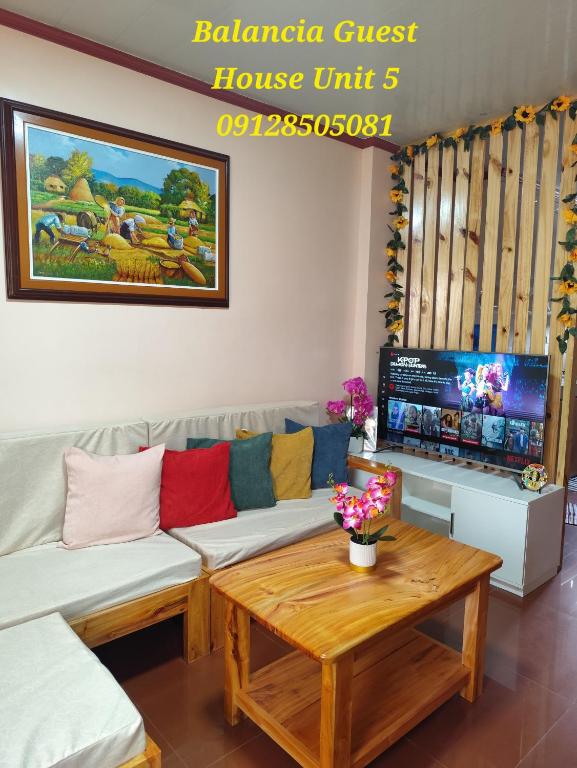 a living room with a couch and a coffee table at Balancia Guest House 3F unit 5 in Baguio