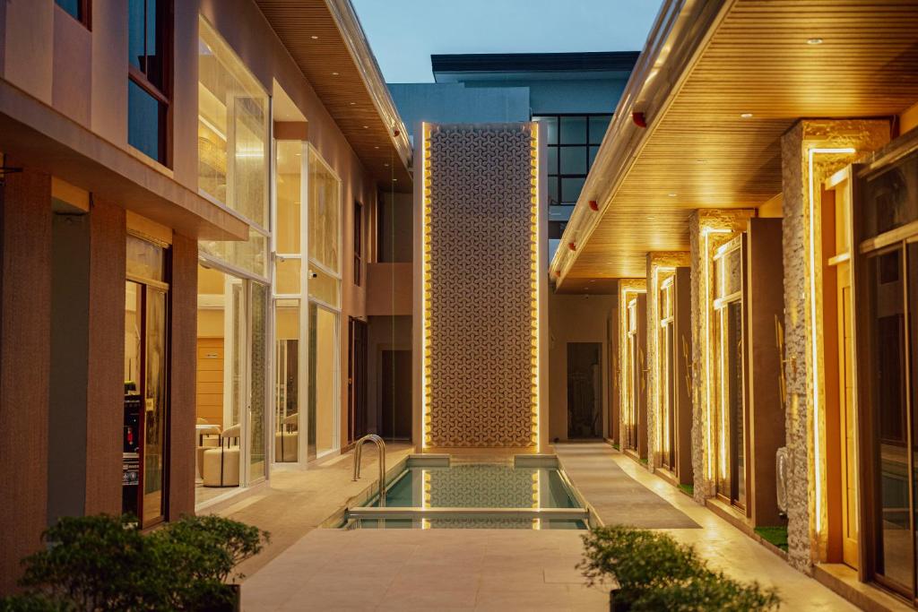 a swimming pool in the middle of a building at KHAMI HOUSE Resort in Panglao Island
