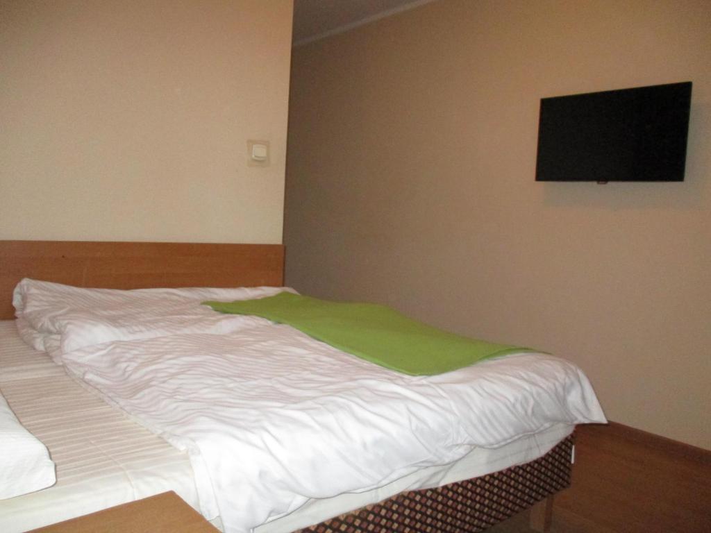Łóżko lub łóżka w pokoju w obiekcie Hotel Pod Platanami