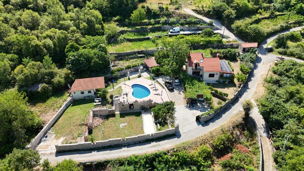 an aerial view of a house with a swimming pool at Vila Pegaz in Virpazar