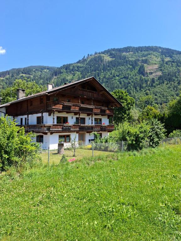 a house on a hill with a green field at Landhaus Gollner in Uderns