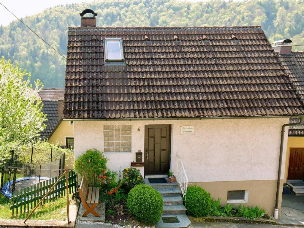 a house with a staircase leading to a door at Ferienhaus Trautner in Muggendorf
