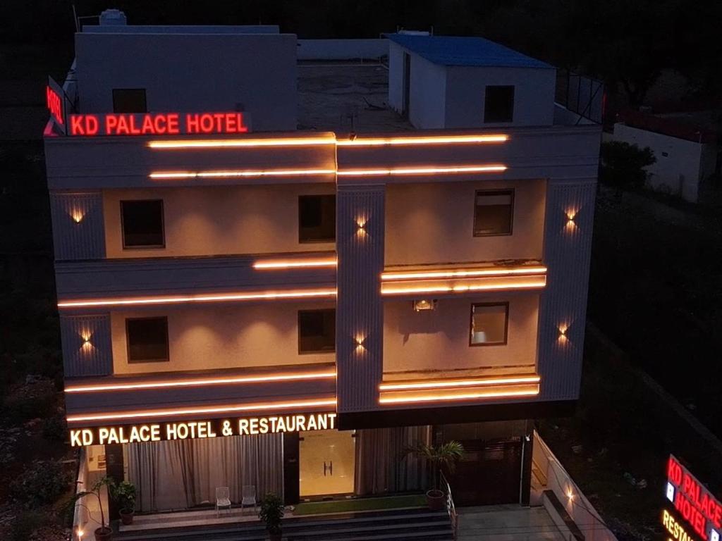 a building with a no palace hotel and restaurant at night at KD Palace Hotel And Restaurant in Jaipur